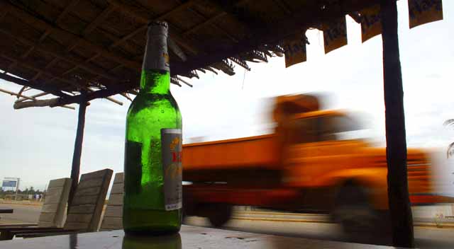 Truck passing a highway bar