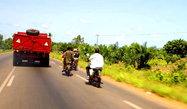 Motos passing a truck