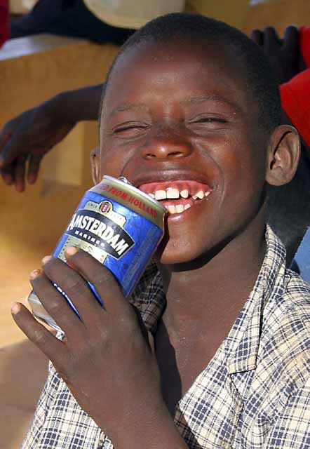 Kid with recycled beer can drink