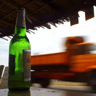 Truck passing a highway bar