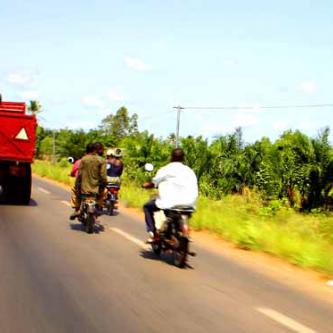 Motos passing a truck