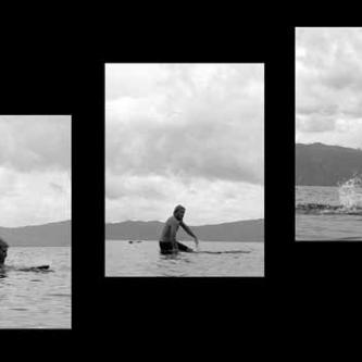 Karl tries his hand at surfing on a lake